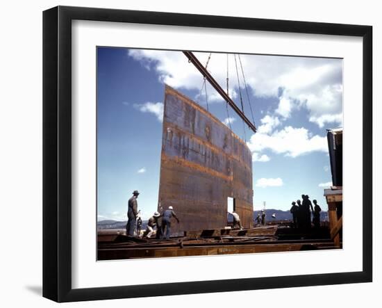 Workers Watching as Steel Beam is Raised High Above During Sub Assembling of Ship at Shipyard-Hansel Mieth-Framed Photographic Print