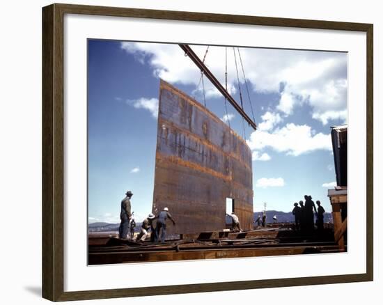 Workers Watching as Steel Beam is Raised High Above During Sub Assembling of Ship at Shipyard-Hansel Mieth-Framed Photographic Print