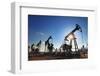 Working Oil Pumps Silhouette against Sun-Kokhanchikov-Framed Photographic Print