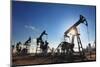 Working Oil Pumps Silhouette against Sun-Kokhanchikov-Mounted Photographic Print