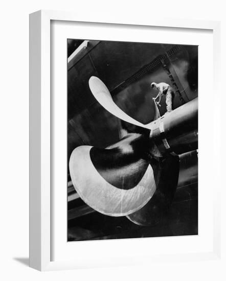 Workman Checking Out One of the Newly Constructed 34 Ton Propellers-Alfred Eisenstaedt-Framed Photographic Print