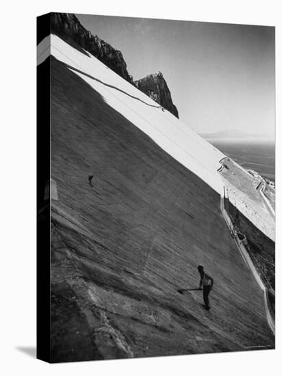 Workman Cleaning Concrete Which Catches Rain Water on Gibraltar-Ralph Crane-Stretched Canvas