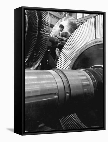 Workman on Large Wheel That Looks Like Fan, at General Electric Laboratory-Alfred Eisenstaedt-Framed Stretched Canvas