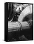 Workman on Large Wheel That Looks Like Fan, at General Electric Laboratory-Alfred Eisenstaedt-Framed Stretched Canvas