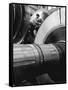 Workman on Large Wheel That Looks Like Fan, at General Electric Laboratory-Alfred Eisenstaedt-Framed Stretched Canvas