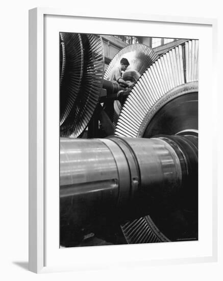 Workman on Large Wheel That Looks Like Fan, at General Electric Laboratory-Alfred Eisenstaedt-Framed Photographic Print