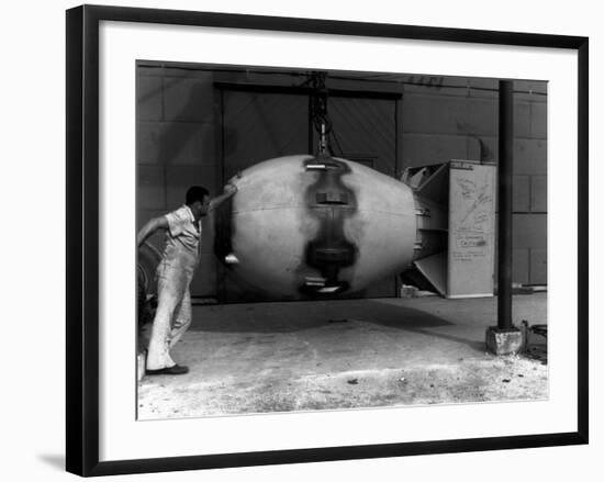 Workman Standing Next to Atomic Bomb Number 2, Nicknamed Fat Man, Hours before its Deployment-null-Framed Photographic Print