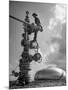 Workman Standing on Machinery at Natural Gas Plant-Thomas D^ Mcavoy-Mounted Photographic Print