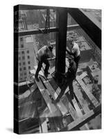 Workmen Attach Steel Beams Above Street During Construction of the Manhattan Company Building-Arthur Gerlach-Stretched Canvas