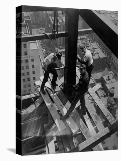 Workmen Attach Steel Beams Above Street During Construction of the Manhattan Company Building-Arthur Gerlach-Stretched Canvas