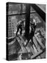 Workmen Attach Steel Beams Above Street During Construction of the Manhattan Company Building-Arthur Gerlach-Stretched Canvas