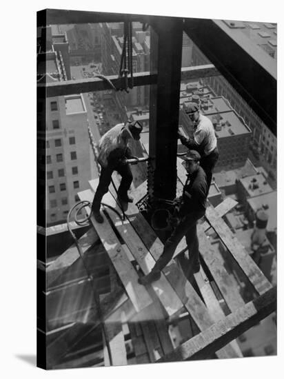 Workmen Attach Steel Beams Above Street During Construction of the Manhattan Company Building-Arthur Gerlach-Stretched Canvas