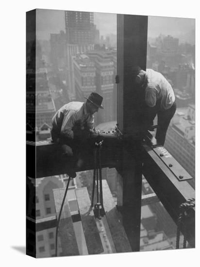 Workmen Attaching Steel Beams High Above Street During Construction of Manhattan Company Building-Arthur Gerlach-Stretched Canvas