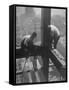 Workmen Attaching Steel Beams High Above Street During Construction of Manhattan Company Building-Arthur Gerlach-Framed Stretched Canvas