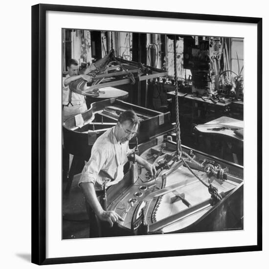 Workmen Installing Steel String Frames Into Grand Piano Cabinets at Steinway Piano Factory-Margaret Bourke-White-Framed Photographic Print