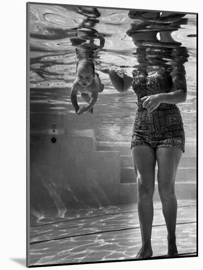 World's Youngest Swimmer Julie Sheldon, 9 Weeks Old, Swimming Underwater-Ed Clark-Mounted Photographic Print