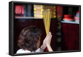 Worshipper burning incense sticks, Taoist temple, Phuoc An Hoi Quan Pagoda-Godong-Framed Photographic Print