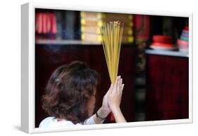 Worshipper burning incense sticks, Taoist temple, Phuoc An Hoi Quan Pagoda-Godong-Framed Photographic Print