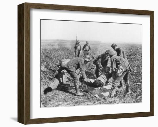 Wounded German Soldier Being Moved by Prisoners, Aisne, France, 18 July, 1918-null-Framed Giclee Print