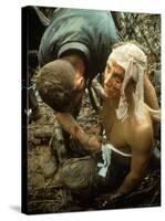 Wounded Marine Being Bandaged in Muddy Jungle During OP Prairie US Military Sweep South of DMZ-Larry Burrows-Stretched Canvas