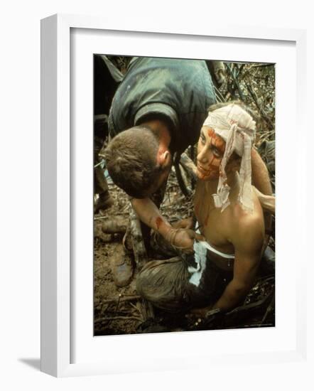 Wounded Marine Being Bandaged in Muddy Jungle During OP Prairie US Military Sweep South of DMZ-Larry Burrows-Framed Photographic Print