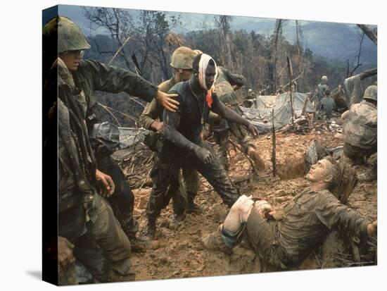 Wounded Marine Gunnery Sgt. Jeremiah Purdie During the Vietnam War-Larry Burrows-Stretched Canvas
