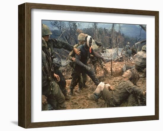 Wounded Marine Gunnery Sgt. Jeremiah Purdie During the Vietnam War-Larry Burrows-Framed Photographic Print