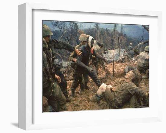 Wounded Marine Gunnery Sgt. Jeremiah Purdie During the Vietnam War-Larry Burrows-Framed Photographic Print