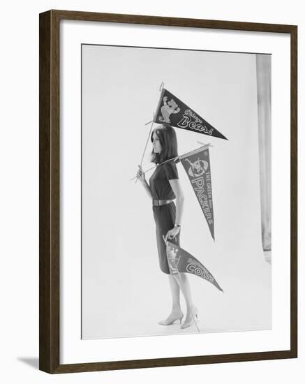 Writer Gloria Steinem Carrying Pennants for Professional Football Teams-Yale Joel-Framed Premium Photographic Print