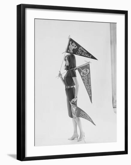 Writer Gloria Steinem Carrying Pennants for Professional Football Teams-Yale Joel-Framed Premium Photographic Print