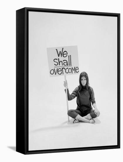 Writer Gloria Steinem Sitting on Floor with Sign "We Shall Overcome" Regarding Pop Culture-Yale Joel-Framed Stretched Canvas