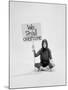 Writer Gloria Steinem Sitting on Floor with Sign "We Shall Overcome" Regarding Pop Culture-Yale Joel-Mounted Premium Photographic Print