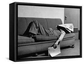 Writer Niven Busch Lying on Sofa with Newspaper over His Face as He Takes Nap from Screenwriting-Paul Dorsey-Framed Stretched Canvas