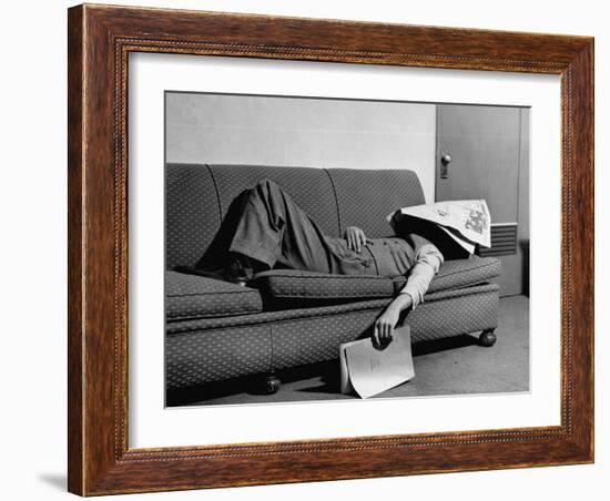 Writer Niven Busch Lying on Sofa with Newspaper over His Face as He Takes Nap from Screenwriting-Paul Dorsey-Framed Photographic Print