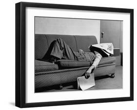 Writer Niven Busch Lying on Sofa with Newspaper over His Face as He Takes Nap from Screenwriting-Paul Dorsey-Framed Photographic Print