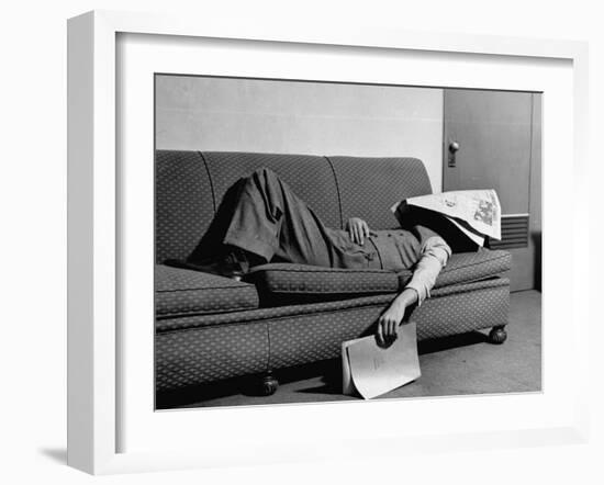 Writer Niven Busch Lying on Sofa with Newspaper over His Face as He Takes Nap from Screenwriting-Paul Dorsey-Framed Photographic Print