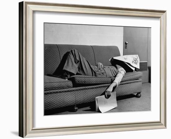 Writer Niven Busch Lying on Sofa with Newspaper over His Face as He Takes Nap from Screenwriting-Paul Dorsey-Framed Photographic Print