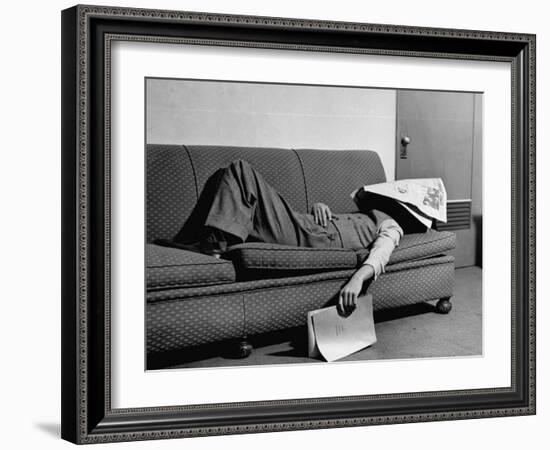 Writer Niven Busch Lying on Sofa with Newspaper over His Face as He Takes Nap from Screenwriting-Paul Dorsey-Framed Photographic Print