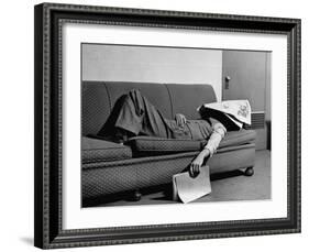 Writer Niven Busch Lying on Sofa with Newspaper over His Face as He Takes Nap from Screenwriting-Paul Dorsey-Framed Photographic Print