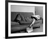 Writer Niven Busch Lying on Sofa with Newspaper over His Face as He Takes Nap from Screenwriting-Paul Dorsey-Framed Photographic Print