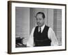 Writer Robert Benchley, Sitting at His Desk with a Small Wade of Paper in His Mouth-Bernard Hoffman-Framed Premium Photographic Print