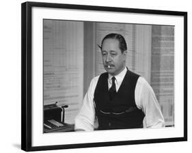 Writer Robert Benchley, Sitting at His Desk with a Small Wade of Paper in His Mouth-Bernard Hoffman-Framed Premium Photographic Print