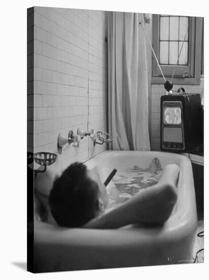 Writer Russell Finch Taking Portable Television Set to Bathroom During His Bath-George Skadding-Stretched Canvas