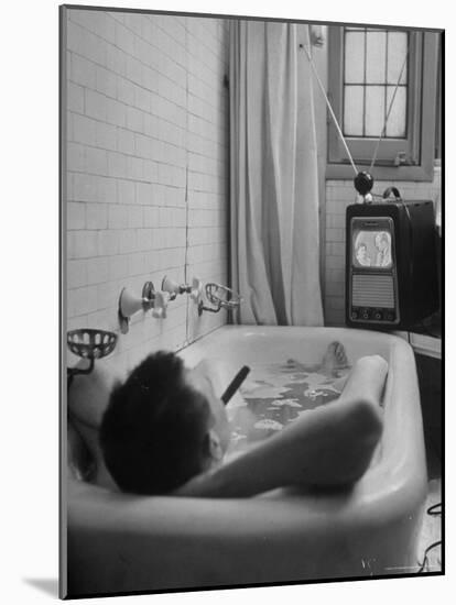 Writer Russell Finch Taking Portable Television Set to Bathroom During His Bath-George Skadding-Mounted Photographic Print