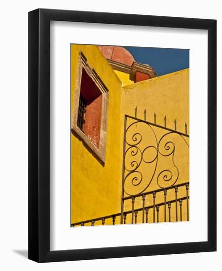 Wrought Iron Fence Against a Yellow Church Wall with Barred Window Against a Blue Sky, Mexico-Judith Zimmerman-Framed Photographic Print