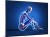 X-Ray View of a Woman Sitting on Floor with Skeletal Bones Superimposed-null-Mounted Art Print