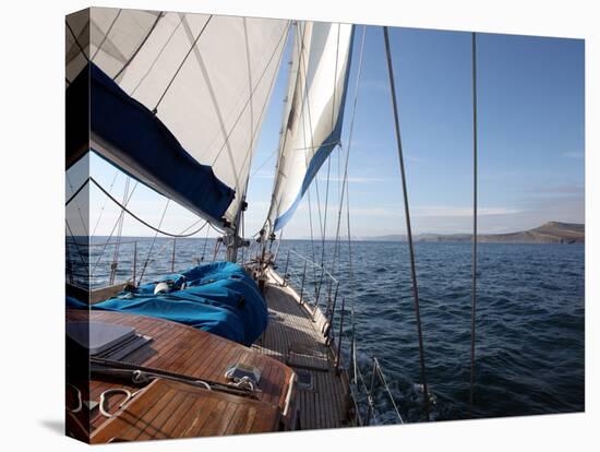 Yacht Sailing West Along the Coast, Dorset, England, United Kingdom, Europe-David Lomax-Stretched Canvas