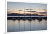 Yachts moored in The Cobb with Jurassic Coast and Golden Cap at sunrise, Lyme Regis, Dorset, Englan-Stuart Black-Framed Photographic Print