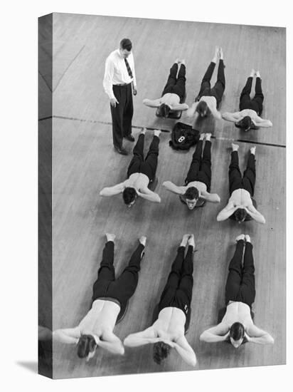 Yale University Swimmers Do Strengthening Exercises on Floor of Gym-Alfred Eisenstaedt-Stretched Canvas