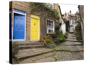Yellow and Blue Doors on Houses in the Opening, Robin Hood's Bay, England-Pearl Bucknall-Stretched Canvas